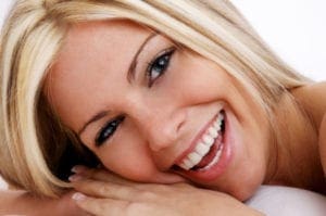 a blonde woman smiling